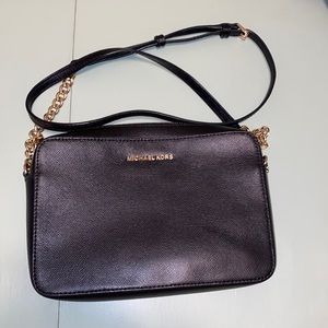 Michael Kors black crossbody leather purse.